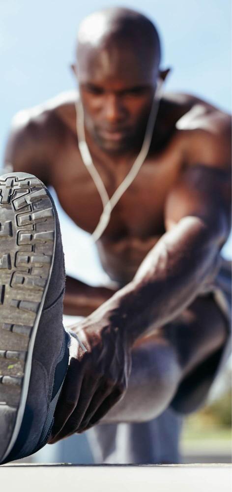 Outdoor pre workout stretching close up highlighting flexibility and joint mobility supported by collagen supplementation.