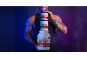 Muscular person holding three stacked Ultimate Nutrition supplement containers including Pure Whey Amino Acids L Glutamine Amino Acid Powder and 50 Advanced High Protein with blue and purple lighting creating a strong fitness themed atmosphere