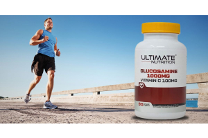 runner on an outdoor path beside an ultimate nutrition glucosamine supplement bottle to illustrate how glucosamine supports joint health for the article the complete guide to glucosamine supplements for joint health