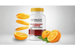 ultimate nutrition glucosamine 1000mg vitamin c 100mg supplement bottle with fresh oranges to illustrate why combining glucosamine with vitamin c supports joint health for the article glucosamine with vitamin c why the combination matters