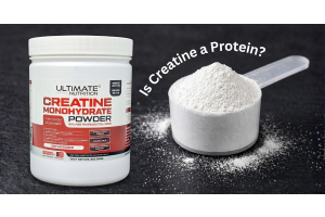 ultimate nutrition creatine monohydrate powder container with a scoop of creatine on a dark surface shown beside the text is creatine a protein to illustrate the difference between creatine and protein for the article is creatine a protein the most google