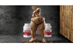 A wooden sculpture of a muscular man carving his own upper body out of a bulky base. In the background, two white tubs of Ultimate Nutrition supplements are displayed, Ultimate Muscle Mass Gain 4000 on the left and Metressyn RX Meal Replacement for Weight