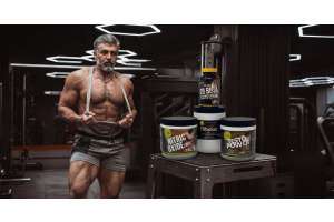 muscular athlete in a gym beside ultimate nutrition testosterone support supplements including nitric oxide tribulus horny goat weed testo power and beta ecdysterone to illustrate the best natural testosterone boosters for men over 50 for the article best