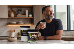 person sitting in a kitchen with ultimate nutrition tribulus horny goat weed and testo power supplements beside a bowl of fruit to illustrate natural herbs that support healthy testosterone levels for the article 6 natural herbs that support healthy testo