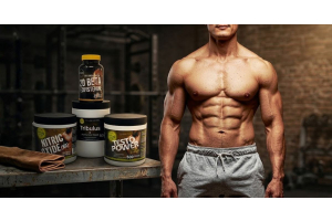 muscular athlete in a gym beside ultimate nutrition testosterone support supplements including nitric oxide tribulus horny goat weed testo power and beta ecdysterone to illustrate whether testosterone boosters can help with erectile dysfunction for the ar